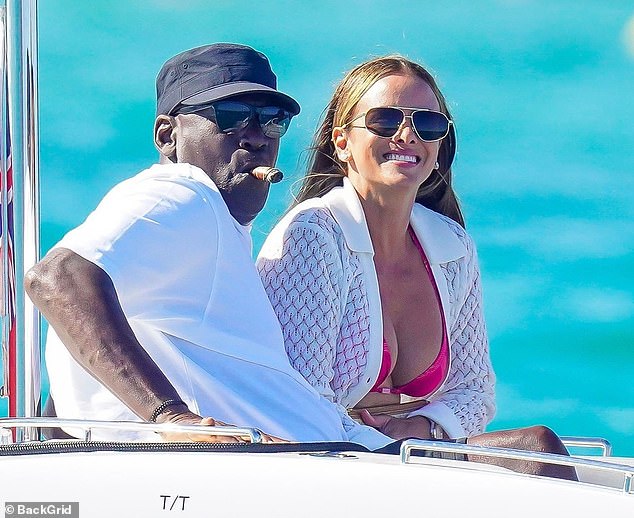 Jordan is seen smoking a cigar as they sail on a boat near the Ligurian Sea