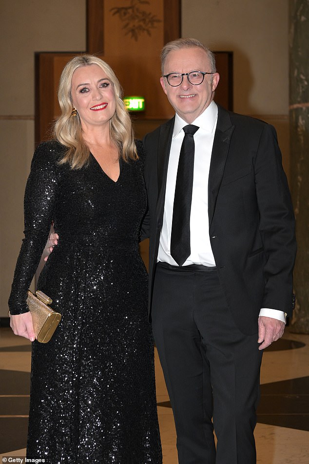 Just before 7.30pm, Prime Minister Anthony Albanese and his fiancée Jodie Haydon arrived wearing Ms Haydon's dress, which had been reused from her appearance at the 2022 ball