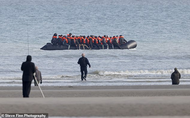 File photo shows a group of migrants trying to cross the Channel from France