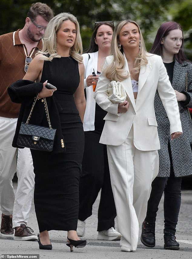 The influencer exuded elegance in a black dress as she walked alongside her sister Zoe, who looked every bit the perfect bride-to-be