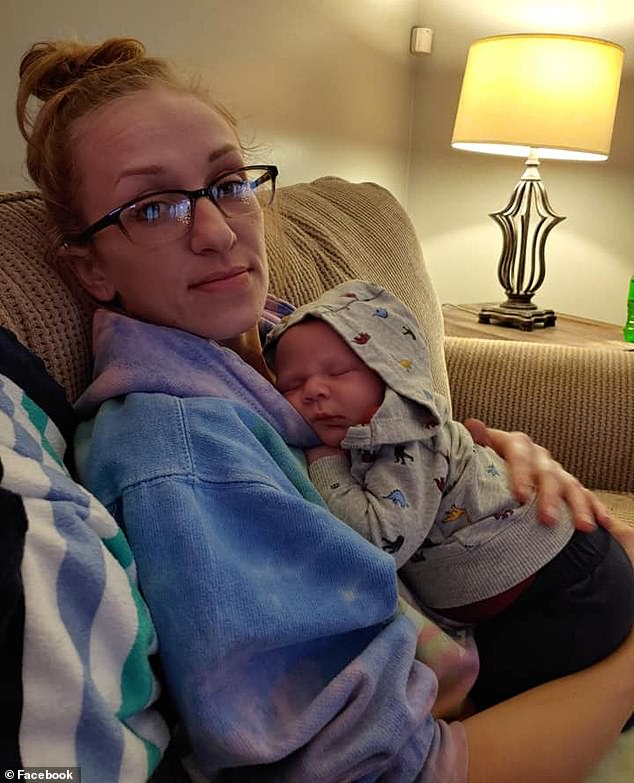 Brianne Ehlinger, 33, is pictured with another baby, not the one who overdosed on heroin. She admitted to exposing her eight-month-old daughter to heroin
