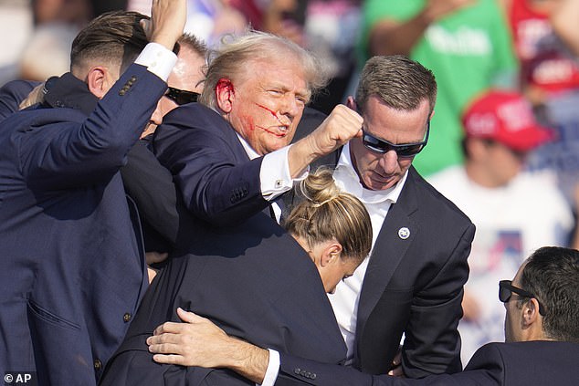 Blood can be seen coming from Donald Trump's ear, where he says he was shot