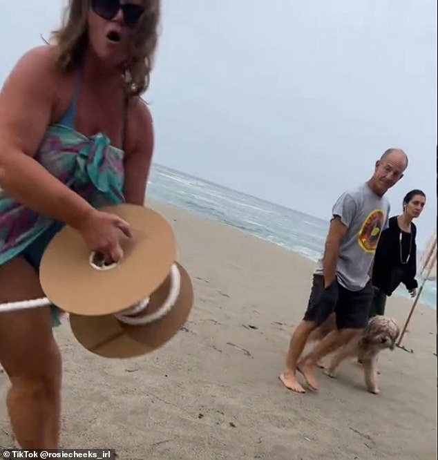 The moment a screaming Karen tried to cordon off parts of a public beach in front of her beautiful California home with barrier tape, while hurling insults at a shocked family, was caught on camera