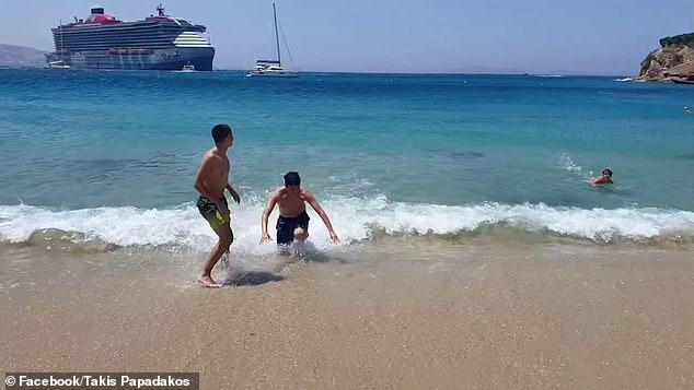 Moment Tourists Are Swept Off Their Feet As Huge Swell From Passing ...