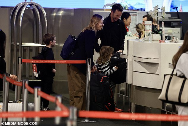 A woman has accused Qantas of giving ACA host Allison Langdon special treatment on a flight from Sydney to Fiji - despite her being seated 'in economy'. However, photos obtained by Daily Mail Australia show Langdon and her family checking in at the business class counter