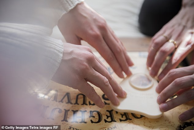 A Ouija board has letters from the Latin alphabet and numbers