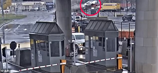 Security camera footage showed the Bentley racing through an intersection, hitting a low median barrier and leaping high into the air just east of the bridge's main vehicle checkpoint