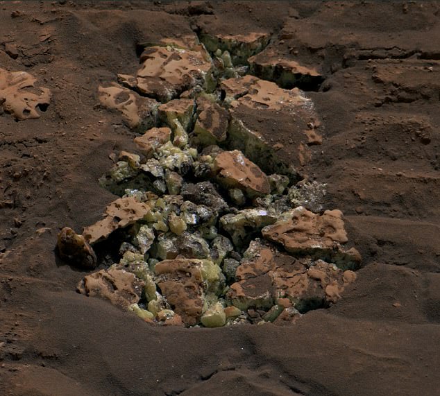 The one-ton rover discovered yellow-green crystals of pure sulfur during its search for chemical evidence the Red Planet was once habitable