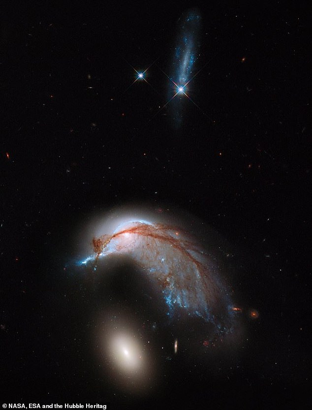 The two galaxies were first imaged by the Hubble Telescope in 2013 (pictured)