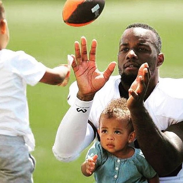 Tashaun Gibson, pictured playing soccer with his children, has been suspended for PED use