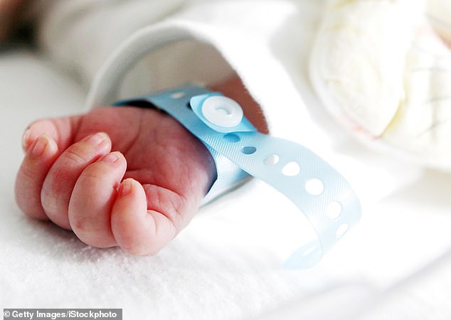 An image of the giant birth announcement, posted to Reddit, quickly caused an online stir as people reacted to the odd name choice. (Image: Stock photo of a newborn baby's hand)