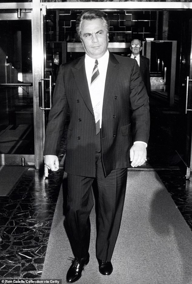 Pictured: Mafia boss John Gotti - Gotti Jr.'s father and predecessor - outside court before he was sent to prison in 1991. He died in 2002