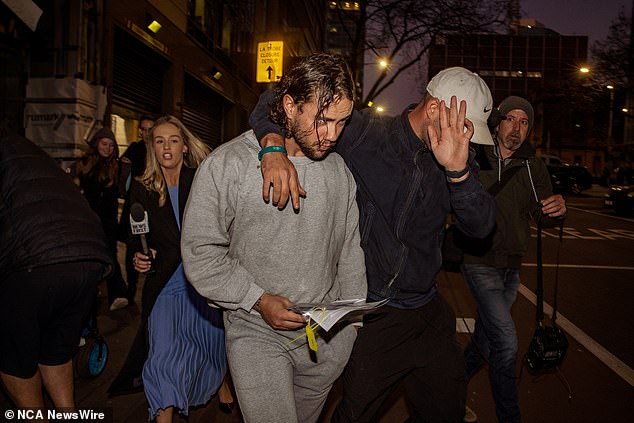Orpheus Pledger is seen leaving Melbourne District Court on Wednesday evening after being released on bail
