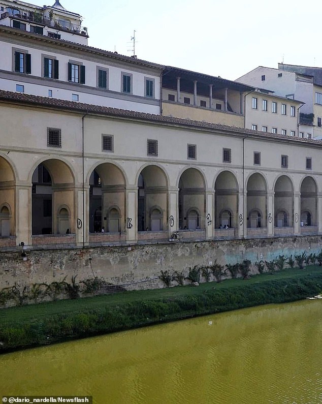 In August last year, two tourists from Germany were arrested for defacing a historic monument in Florence with football graffiti (pictured above)