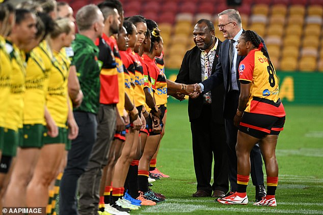 Prime Minister Anthony Albanese and the federal cabinet are expected to approve $600 million to support an NRL team representing Papua New Guinea. Above, he meets players during a rugby league match with Papua New Guinea in 2022.