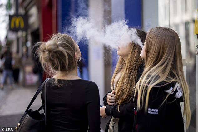 Youth exposed to e-cigarette vapor had 84 percent less of the addictive substance in their bodies compared to those exposed to traditional secondhand cigarette smoke (stock image)