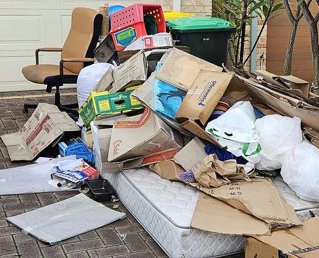 The mover dumped the trash back in Mrs. Moko's driveway and pocketed the $80 cost