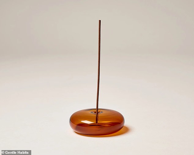 The blonde keeps Gentle Habits incense burning in her office 24/7 and uses the brand's Glass Vessel incense holder in amber (pictured)