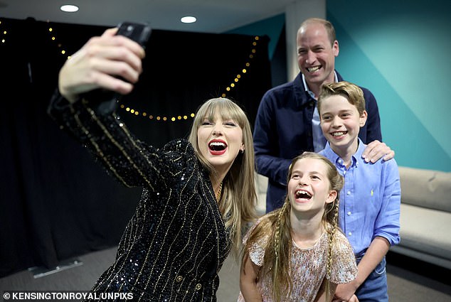 Taylor Swift with Prince George, Princess Charlotte and Prince William during her performance at Wembley last month