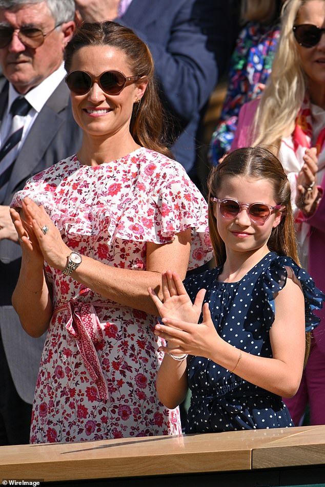 Pictured: Princess Charlotte and her aunt Pippa Middleton during a standing ovation for the Wimbledon men's finalists today