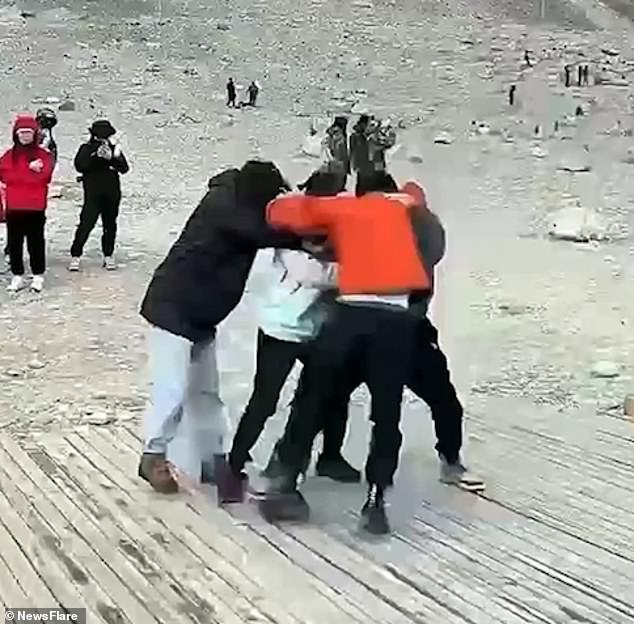 Footage shows two men and two women, reportedly Chinese, colliding near the Everest Elevation Measurement Monument on June 25.