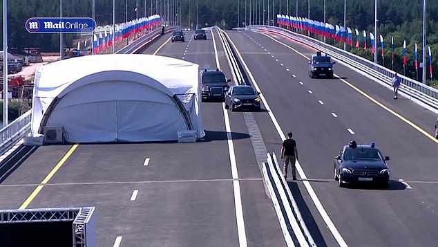 President Vladimir Putin was spotted in a black Lada Aura on the M-11 highway connecting Moscow and St. Petersburg, before turning left to apparently avoid a white obstacle surrounded by tents