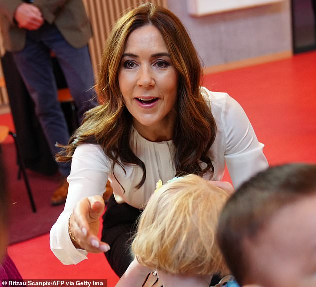 Mary beamed as she interacted with children at the sustainable Naasut facility in Nuuk, which means 'flower' in Greenlandic