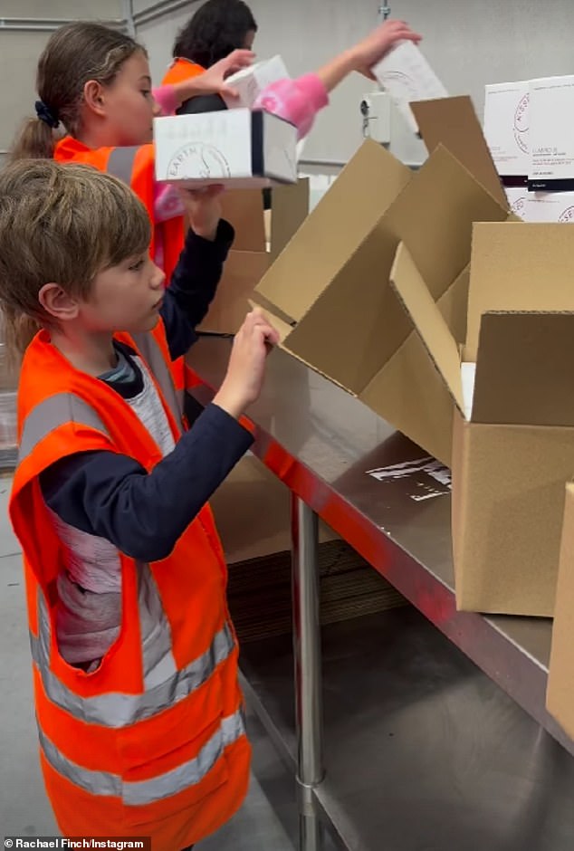 The former Miss Universe Australia winner, 36, shared a clip on Instagram on Monday showing the youngsters hard at work packing boxes with her Kissed Earth line