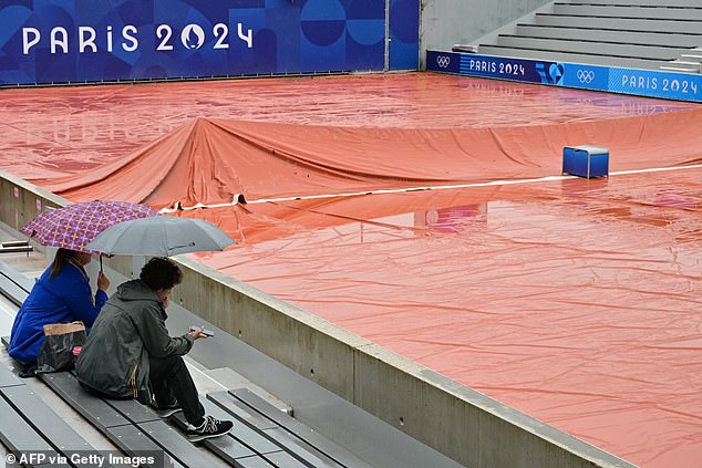 During the downpours that hit Paris, only two courts at Roland Garros were playable on Saturday as they were covered, while other courts were covered with orange plastic sheeting to protect them