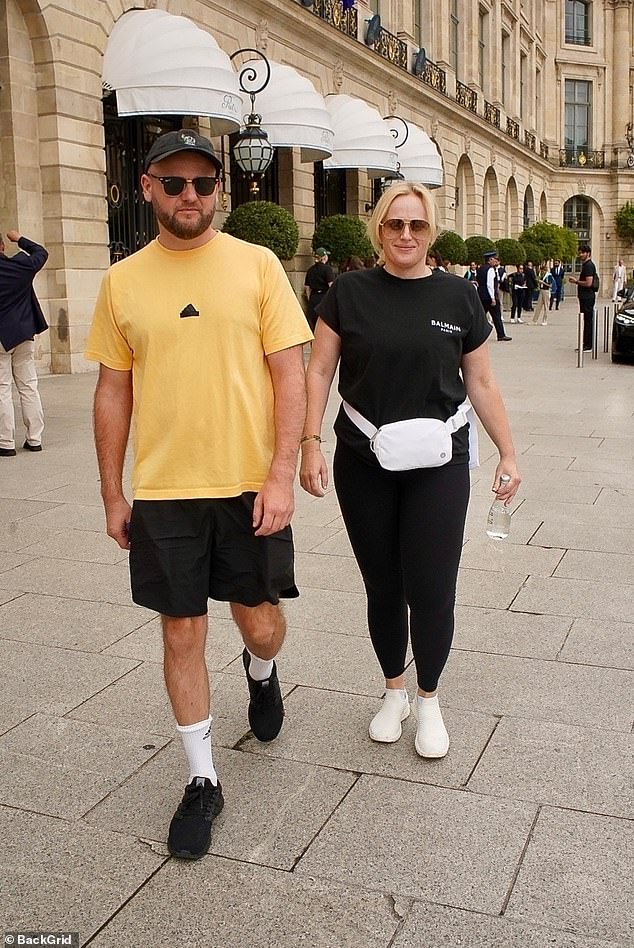 Rebel Wilson wore a black Balmain T-shirt as he walked with a friend in Paris in preparation for the 2024 Olympic Games opening ceremony on Friday