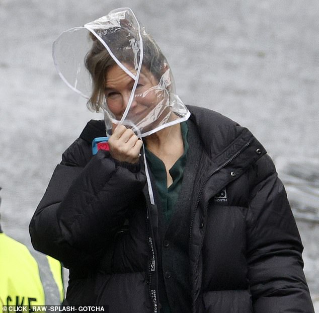 Renee Zellweger, 55, was spotted filming new scenes with Bridget Jones in torrential rain on Tuesday after angering A-list stars by asking them to leave their homes during filming.