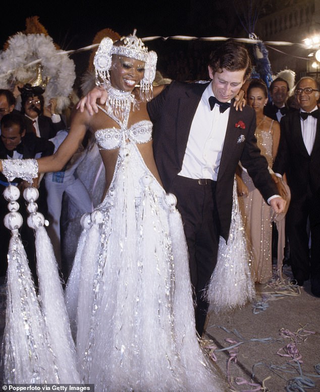 A young 29-year-old Prince Charles dances with a Samba dancer named Pina in Brazil in 1978