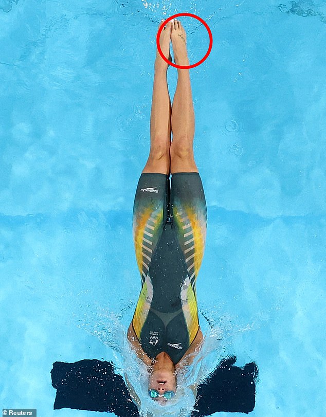 Kaylee McKeown took inspiration from a tattoo of her late father (circled) when she fought back to win gold in the 100m backstroke in Paris on Wednesday morning