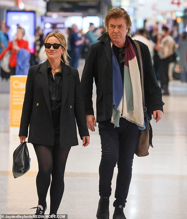 Richard Wilkins and his celebrity makeup artist girlfriend Mia Hawkswell looked positively smitten as they arrived at Sydney Airport on Friday. Both pictured