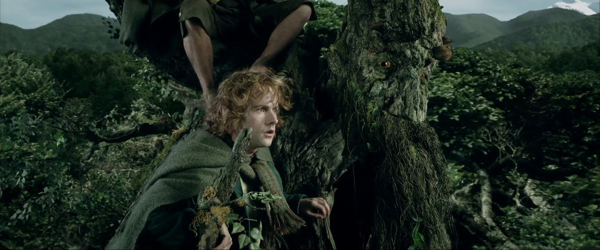 Merry rides on Treebeard's leafy shoulder in The Lord of the Rings: The Two Towers. 