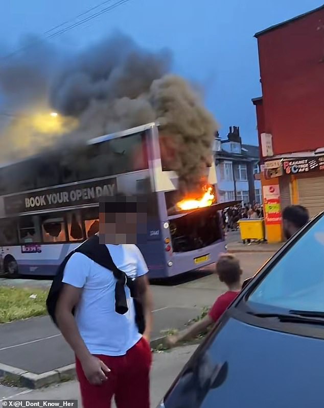 Rioters set fire to a bus in Leeds after a row involving 'agency workers and children' turned into a riot