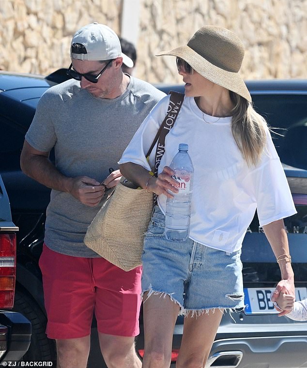 The 35-year-old Northern Irish golfer, who filed for divorce from Erica earlier this year, appeared to be in high spirits as they strolled together on a beach outing