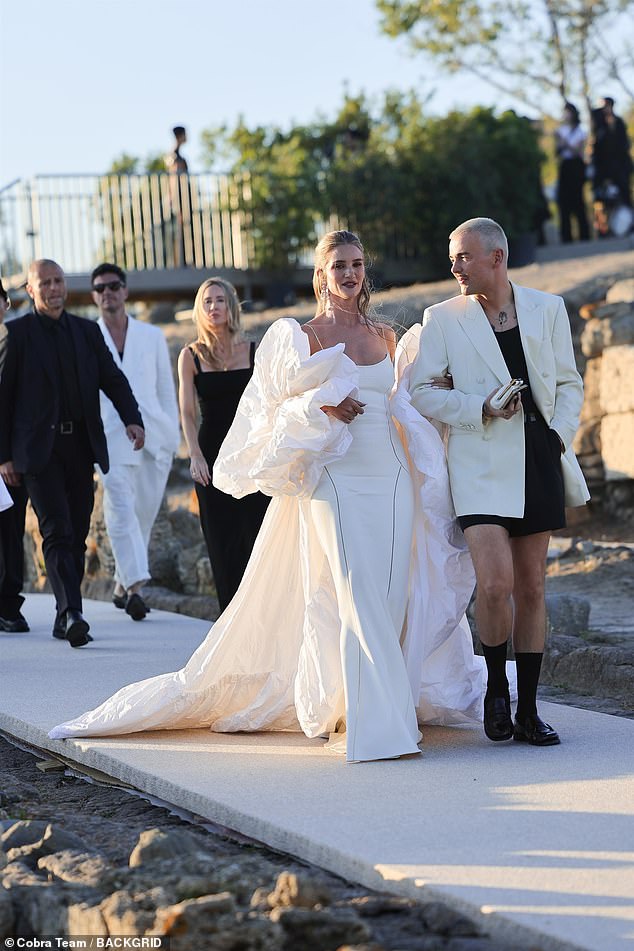 Rosie Huntington-Whiteley and Naomi Campbell wore sexy bridal ensembles as they joined leggy Halle Bailey for the Dolce & Gabbana fashion show in Sardinia on Tuesday