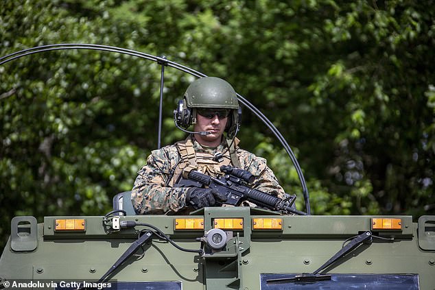 A U.S. Marine is seen on a HIMARS (High-Mobility Artillery Rocket System) during Baltops 24 military exercises on the island of Uto, in the Stockholm archipelago, Sweden.