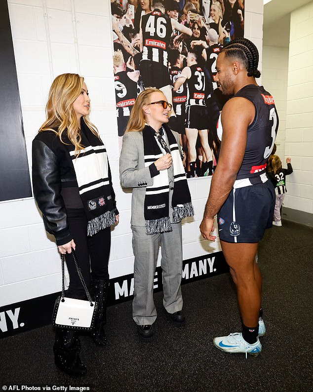 Chrishell Stause, 43, (left) and husband G-Flip, 30, (right) proved they are the Magpies' biggest fans on Sunday when they met the players ahead of the AFL round 20. Pictured with Isaac Quaynor