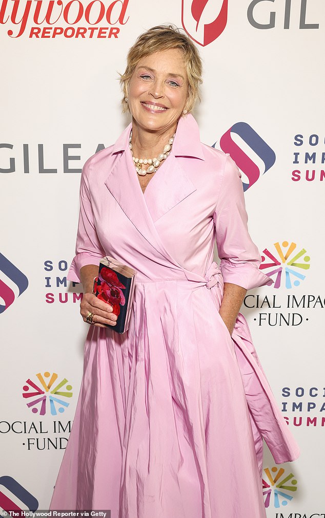 Stone sparkled in a pink floor-length wrap dress