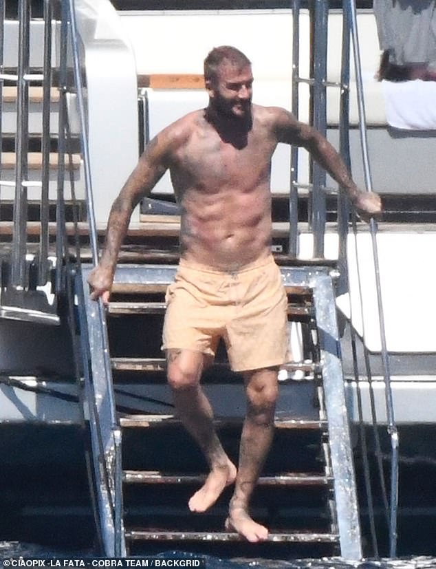 Shirtless David Beckham showed off his six-pack as he holidayed with his family on a mega-yacht in Sardinia to celebrate Harper's 13th birthday