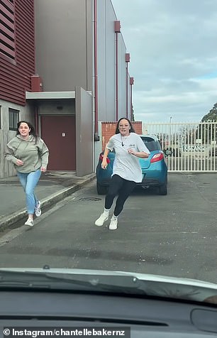 Shocking footage has captured the wild moment a woman smashes the windshield of a car during a violent road rage incident