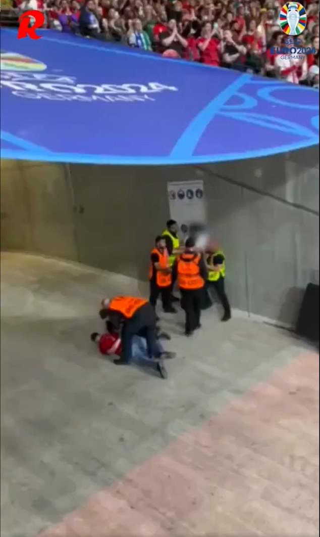 A viral video showed a fan being attacked by a group of stewards at Euro 2024 on Monday