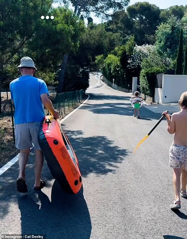 She later shared a clip of her two boys walking down to the local beach in an inflatable boat, while they walked with their boat paddles