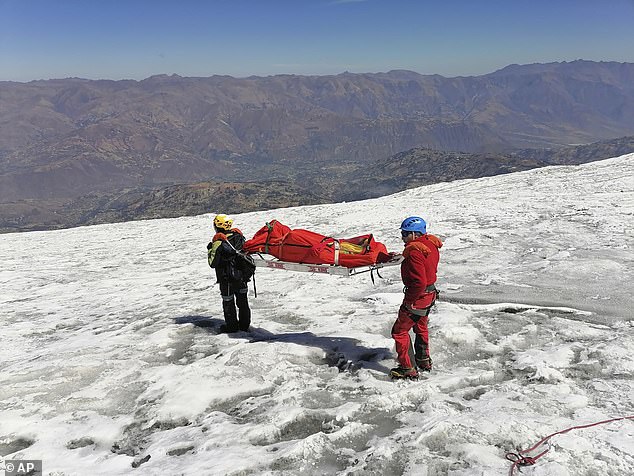 Rescue workers working to retrieve Bill's body from the mountain last week