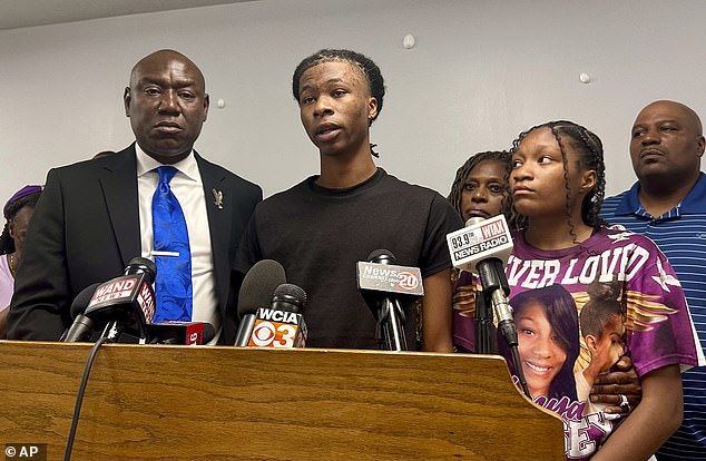 Sonya Massey's 17-year-old son, pictured center, with other family members and attorney Ben Crump, right, told reporters Tuesday that he was unable to view the graphic bodycam video of his mother's death.