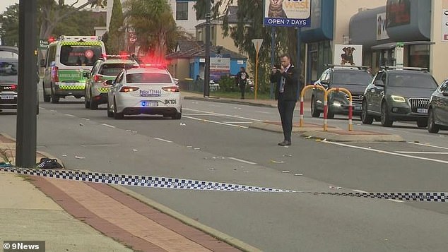 A man is fighting for his life after he was allegedly stabbed on a busy highway - police have charged another man