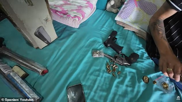 Drugs and weapons are seen in an abandoned, dilapidated apartment in the infamous city of Medellin, Colombia, in a video shot by Australian YouTube star Spaniard