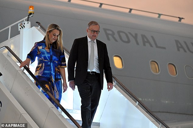 Anthony Albanese and his partner Jodi Haydon are pictured arriving in Delhi for the G20 summit in September